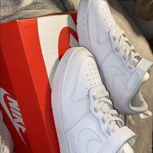 Kids white Nike shoes